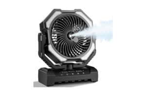 Portable misting fan with a circular blade housing on a sturdy base, emitting a cool mist to the right side.