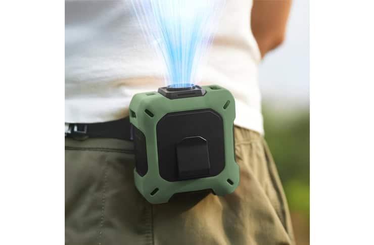 Rugged green belt-clip device emitting a blue laser beam upward from its top.