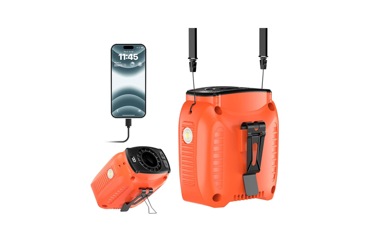 Orange portable air compressor with built-in gauge and two nozzles for inflating tires, shown with a connected phone for scale.
