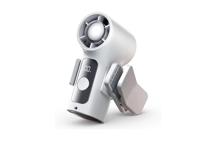 White cordless handheld hair dryer with a circular turbine head, digital display showing 100, and fold-out attachments on the sides.