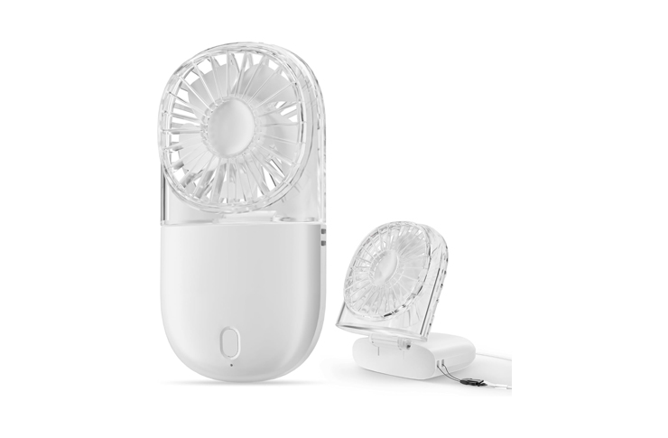 Portable handheld fan with a transparent protective cage and a compact base, shown plugged in and ready for use.