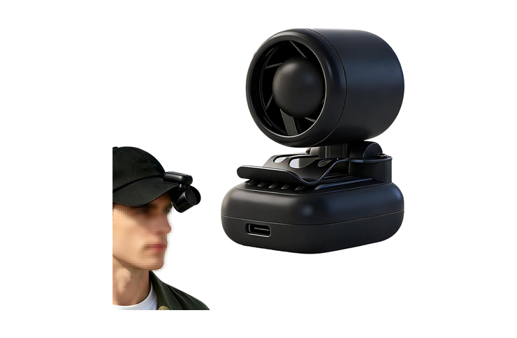 Man in a cap wearing a small head-mounted camera, facing left, next to a large black camera gimbal on a base.