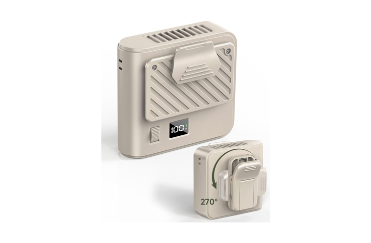Beige compact space heater with a front diagonal vent, digital temperature display, and a fold-out top handle.