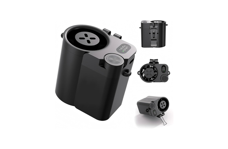 Compact black/gray power unit with circular top port and digital display, shown with detachable batteries and adapters.